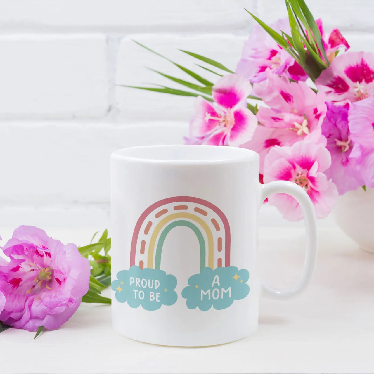 Personalised ceramic mug with a stylish boho rainbow design and "Proud To Be A Mom" quote, a thoughtful and colorful Mother's Day gift for Mum, high-quality UK print.