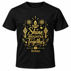 Black personalised Diwali T-shirt with gold Shine Brighter Together lettering, diya lamp, lanterns and fireworks.