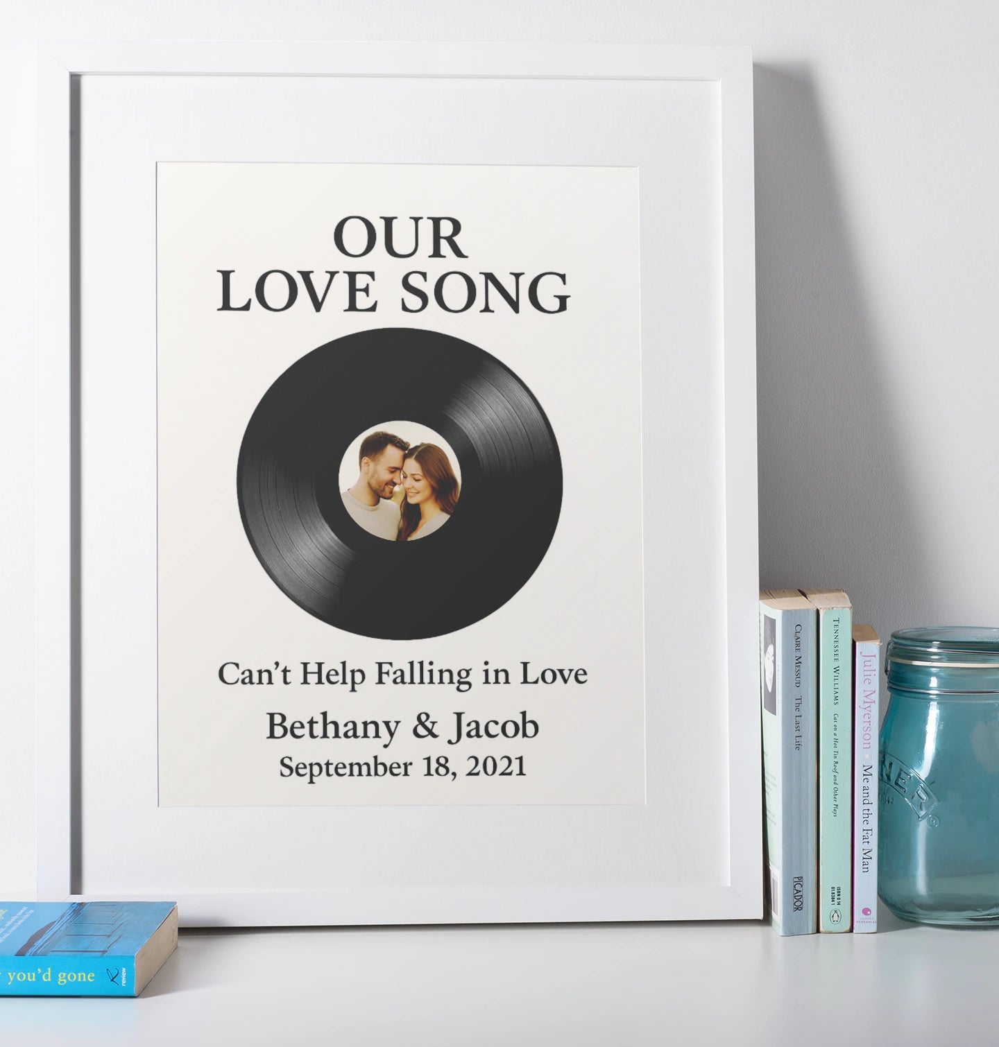Personalised vinyl record wall art with custom photo, names, song title, and date.