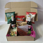 Stella Artois beer bottles snack hamper personalised gift box with savoury snacks nuts and message card gift for beer lovers