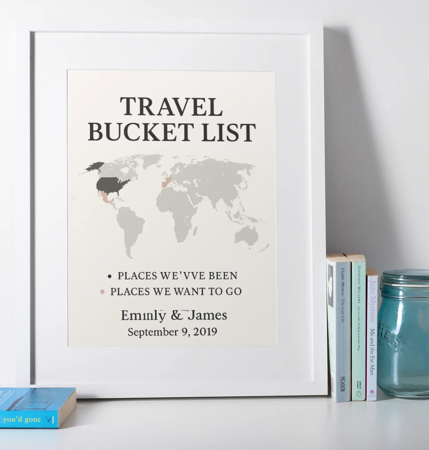 Custom framed travel map wall art showing visited and future travel locations.